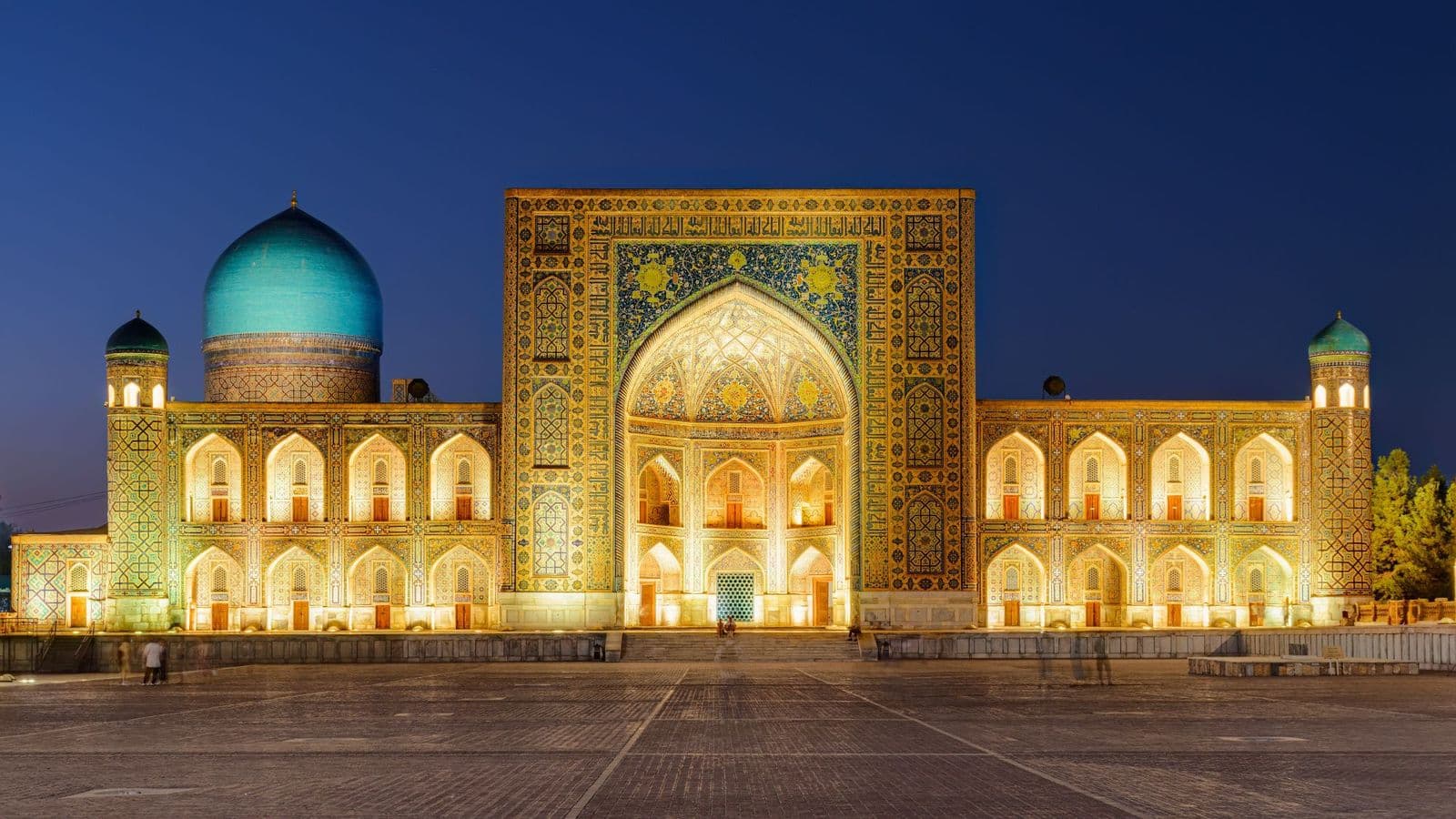 Tilya-Kori madrasah on Registan Square, Samarkand at dusk