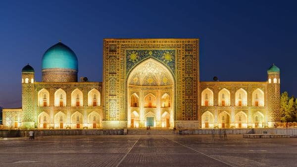 Tilya-Kori madrasah on Registan Square, Samarkand at dusk