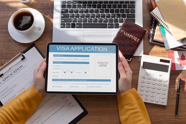 Visa application on a tablet with passport
